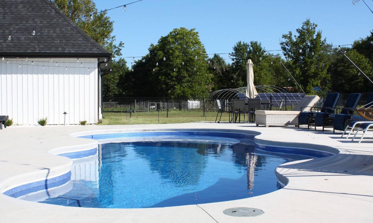 Joplin House | Modern Family Getaway! Heated Pool, Hot tub Theatre Room, Game room!