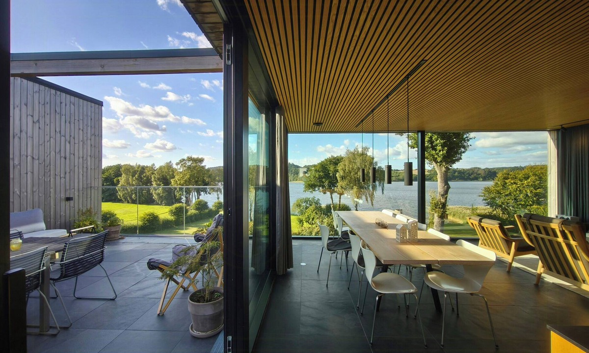 Ry House | Modern villa by Knudsø with jetty