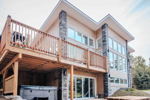 Riviere-Rouge Ski Chalet | Modern Waterfront Cottage on the Rouge River & Spa