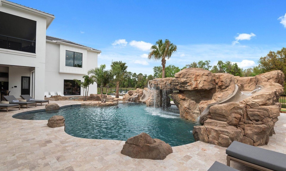 Reunion House | Morlando Three floor rocket ship, luxurious interior, back yard oasis with pool