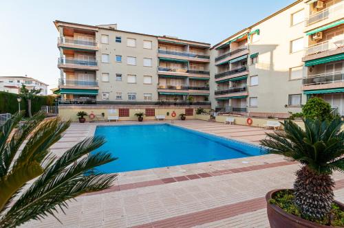 Comarruga Apartment | Near beaches large private patio, aircon & community pool