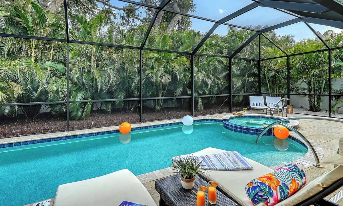 South Poinsettia House | Near Siesta Key | Palm-Lined Pool & Spa Retreat in Sarasota
