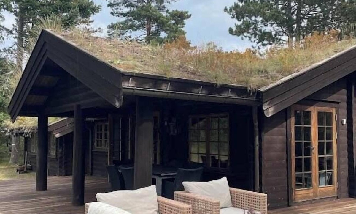 Rrvig House | Norwegian log cabin among heather and pine trees