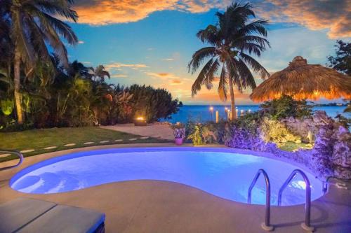 Bay Point House | Oceanfront villa with private beach, heated pool, tiki and boat dock