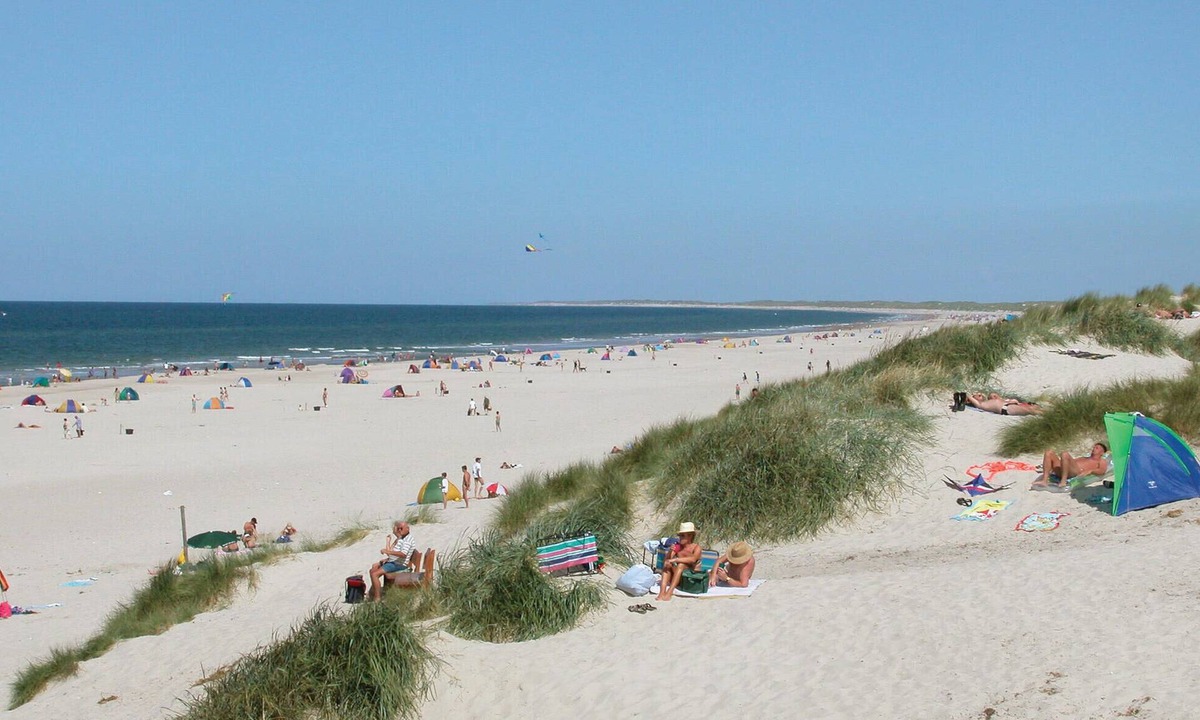 Henne Strand House | On a dune plot lies this beautiful vacation home.