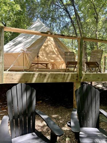 Gentry House | Peaceful Glamping Tents with Elevated Decks, Cozy Fire Pit, and Secluded Forest Views Near Gentry, AR