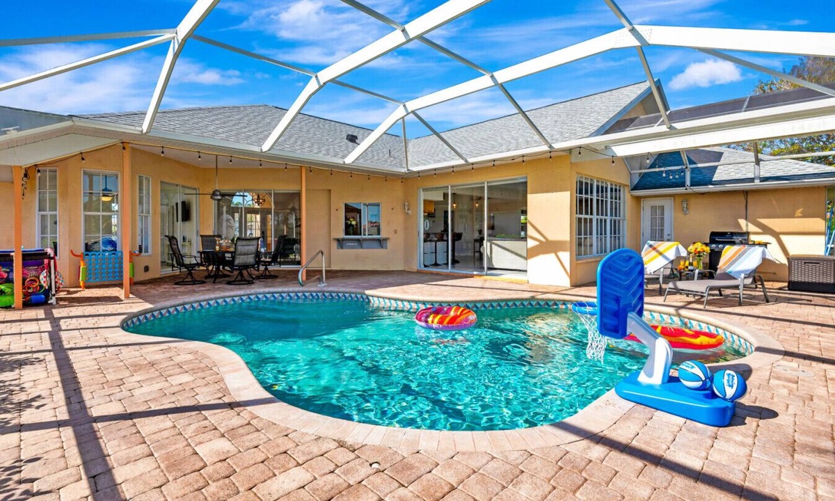 Broadmoor House | Pool + Game Room | Lanai & Canal View