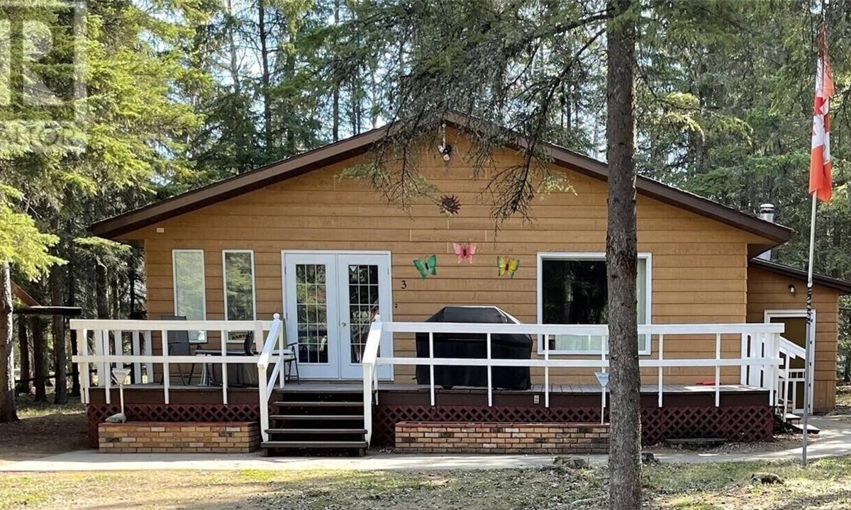 Candle Lake House | Privacy Galore! Enjoy this roomy year round lake home surrounded by the forest