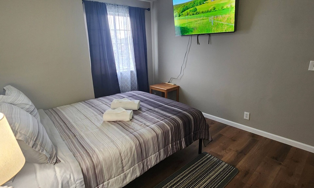 West Jordan House | Private bedroom with a shared bathroom in west jordan
