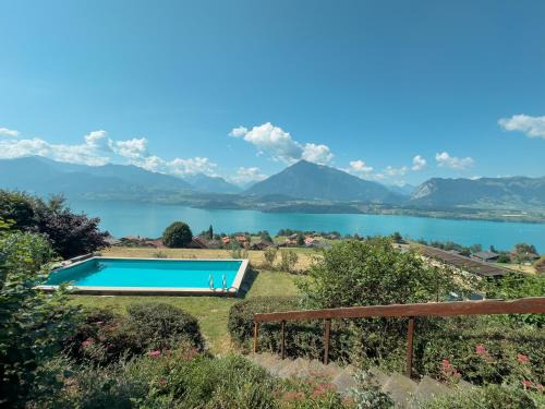 Aeschlen ob Gunten Ski Chalet | Private Chalet with Pool, Lake & Mountain Views