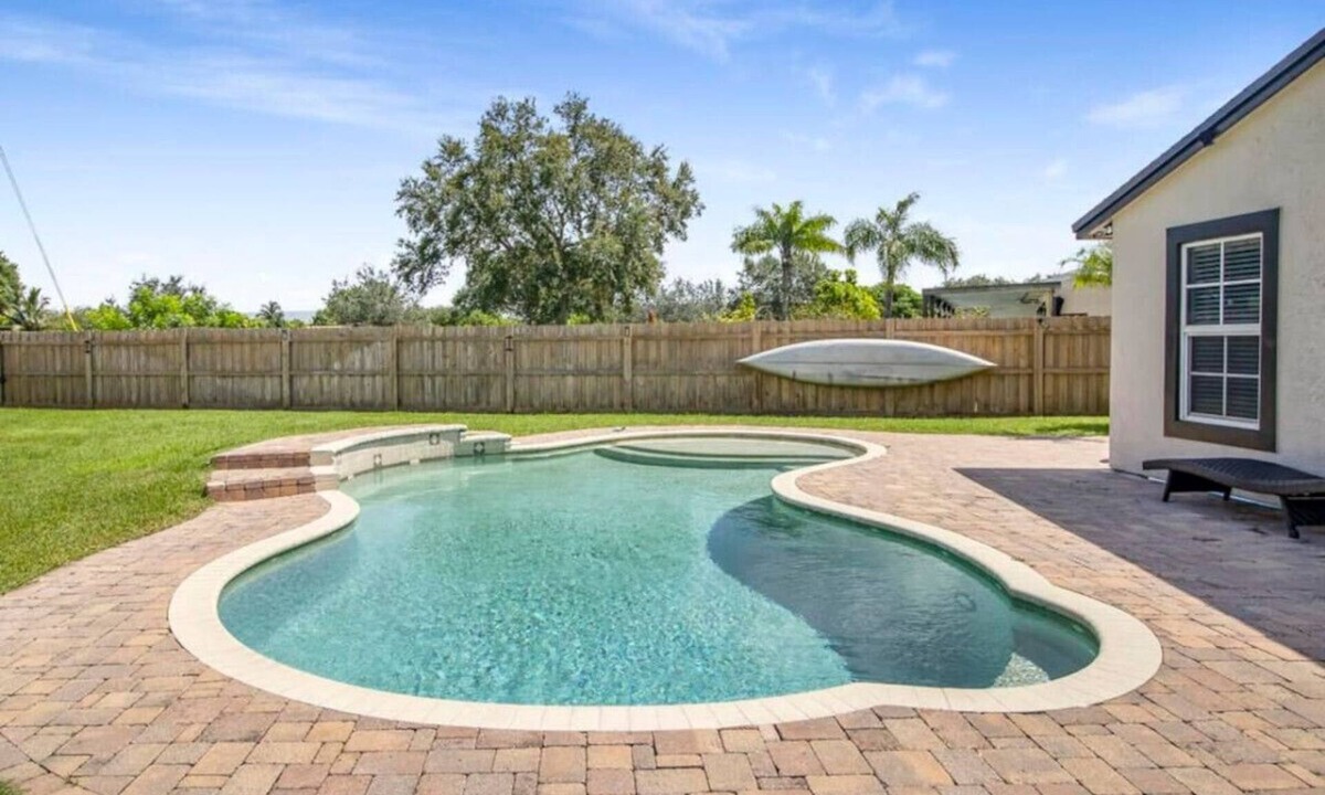 Royal Palm Beach Villa | Private Pool Villa with Waterfall near Wellington & WPB