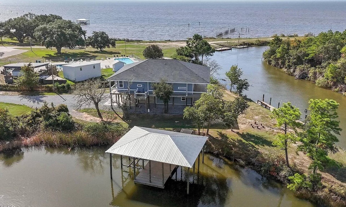 Kreole Cottage | Private Waterfront Retreat 3BD/4BA Hot Tub 2 Boat Docks & Relaxing Coastal Views