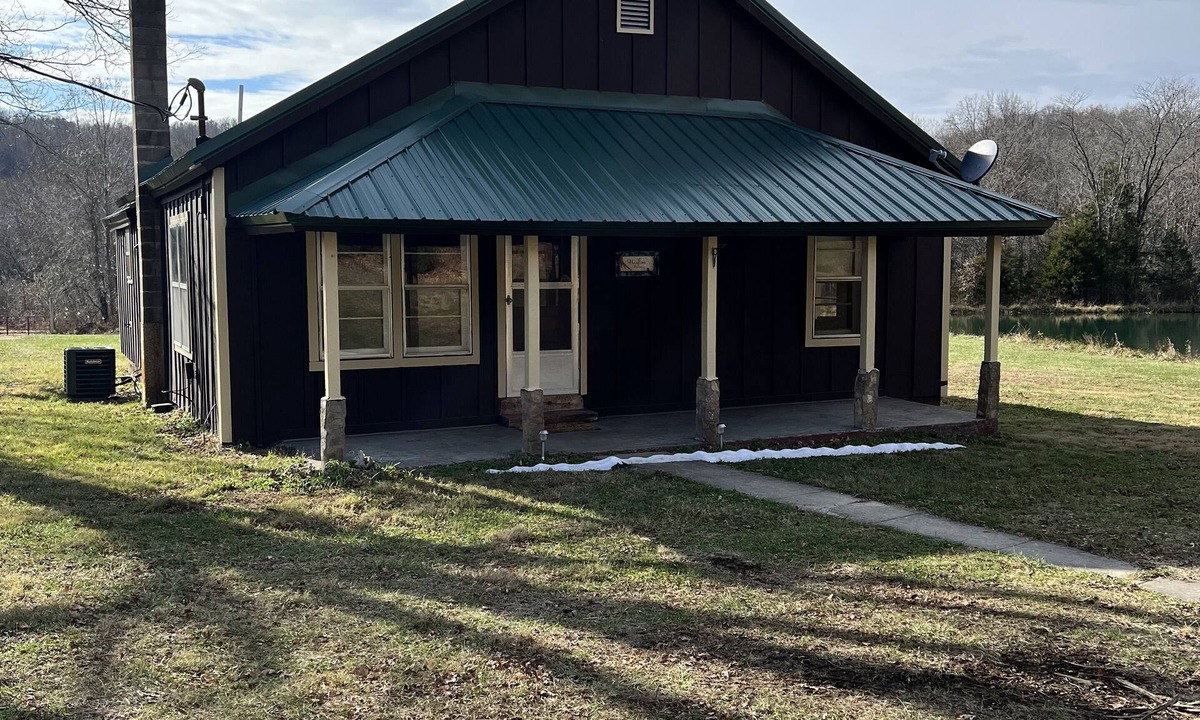 Black Other | Quaint farm house with a small fishing pond.