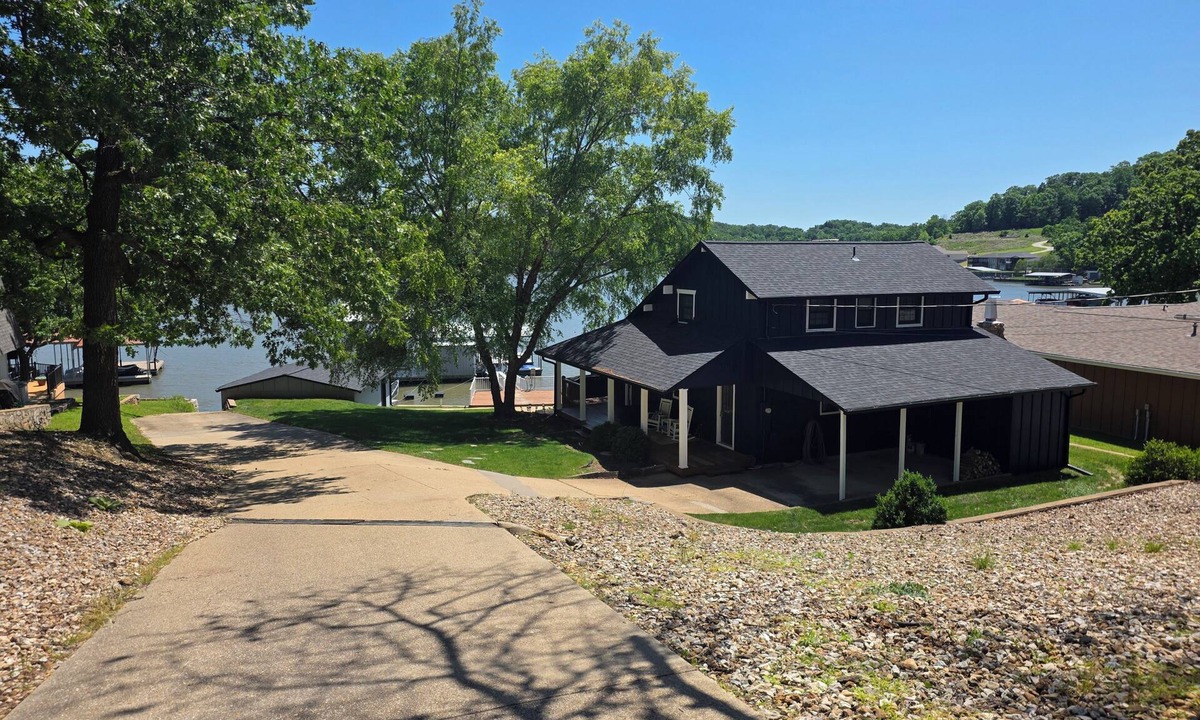 Sunrise Beach House | Rare level lot with boat launch on site. Wood burning fireplace. Dog friendly.