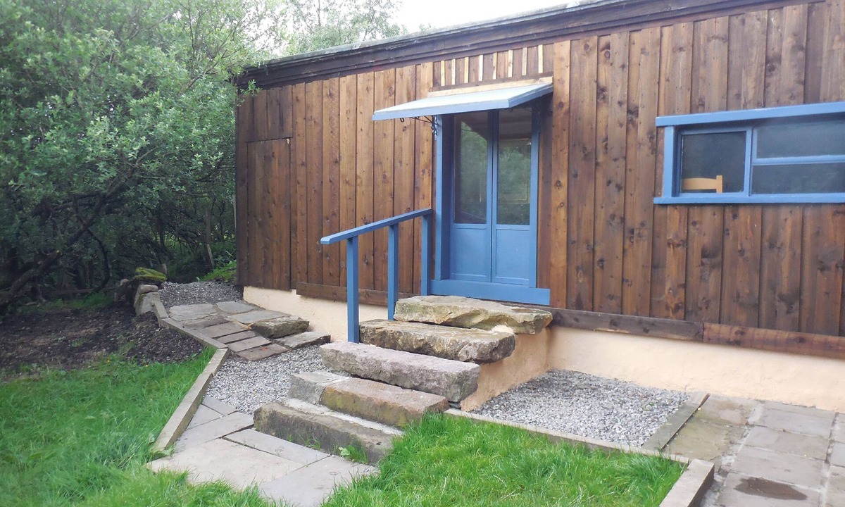 Breakish Cabin | Red Cuillin Cabin on riverbank