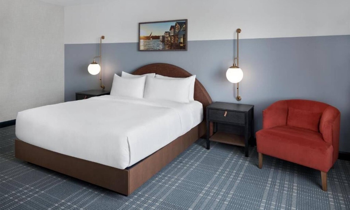 Canandaigua Hotel | Refined Retreat by the Lake with Pool, Outdoor Seating, and Serene Atmosphere