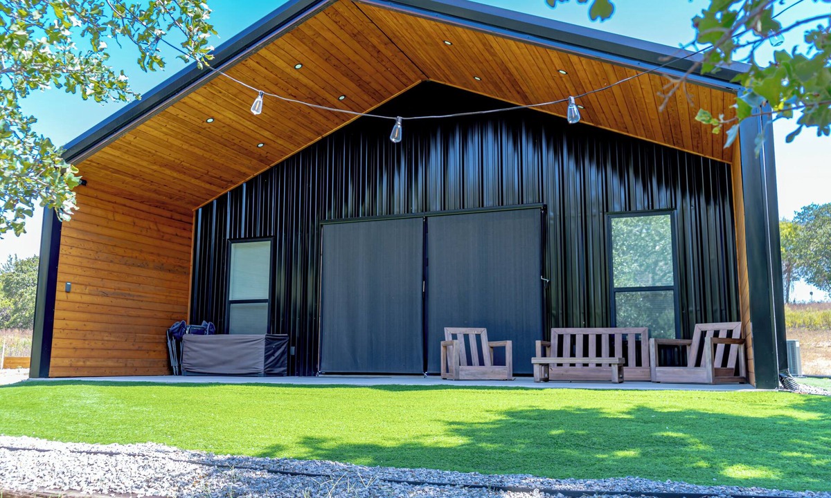 Forestburg House | Relax at this Modern Rustic Barndominium in Nocona. This 2BR, 2BA retreat offers an open layout, chef’s kitchen, spa-style baths, and outdoor patio with fire pit—perfect for families, couples, or friends under the Texas stars.