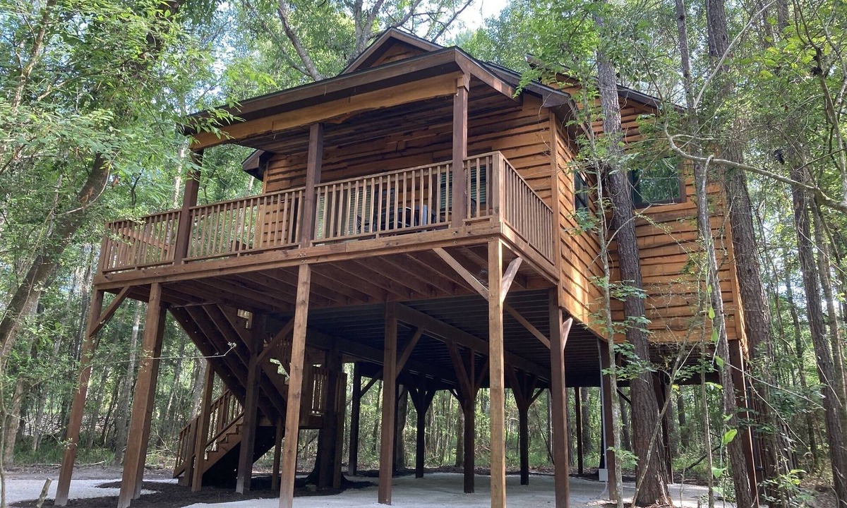Livingston Cabin | Relax with a view from above in a tree-top getaway! Two Creeks Crossing Resort