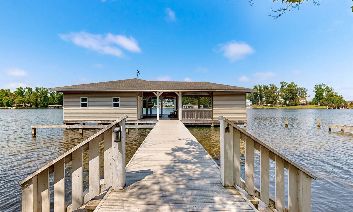 Bumpass House | Relaxing lakeside retreat with boathouse, dock, deck, firepit and screened porch