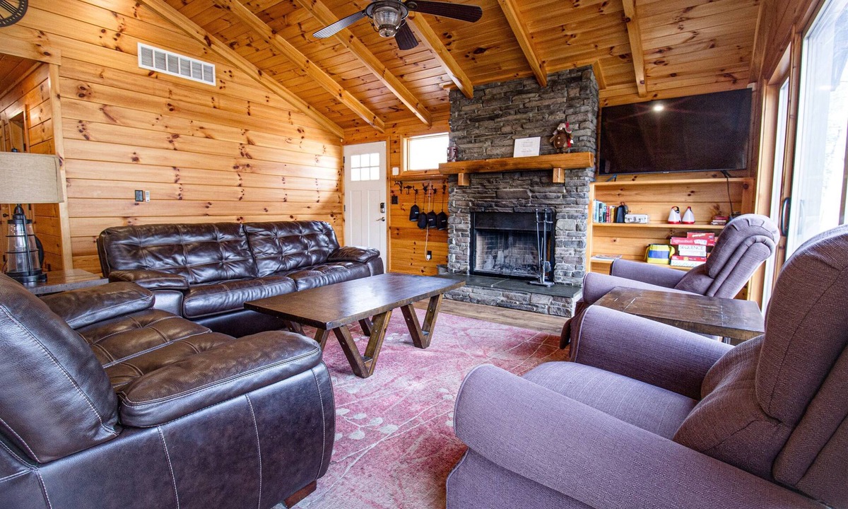 Evart Cabin | Riverfront | Hot Tub, Fireplace, Kayaks & Tubes
