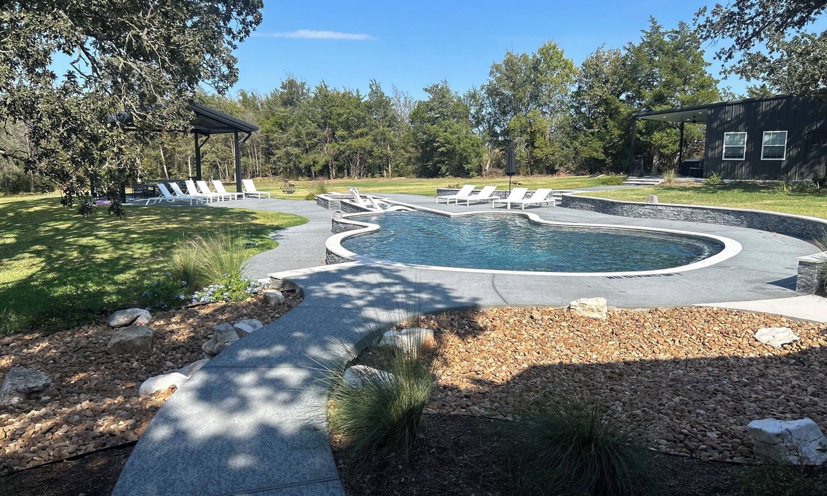 Brenham Resort | RocknRoll Ranch a resort in Brenham, TX features an 85-foot guitar-shaped pool