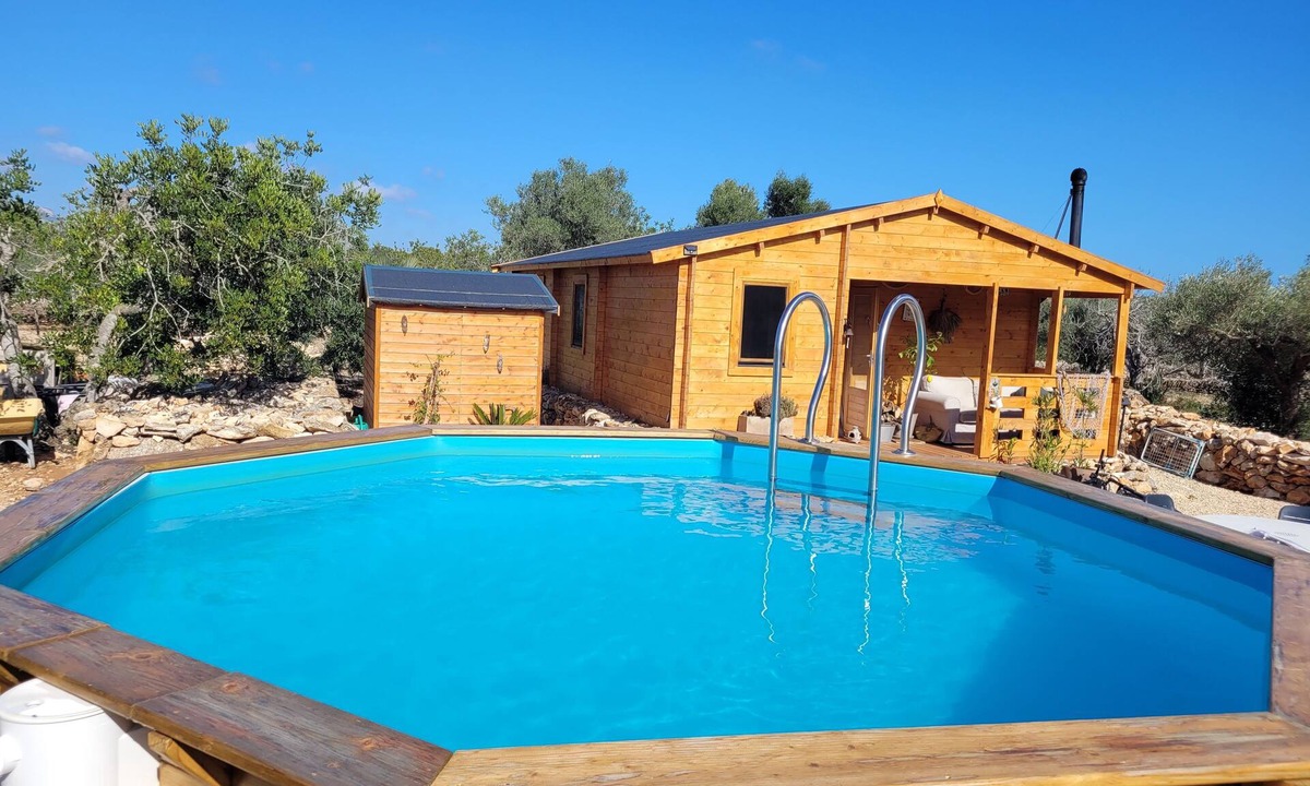 Costa Dorada Ski Chalet | Romantic chalet with private pool surrounded by olive trees.