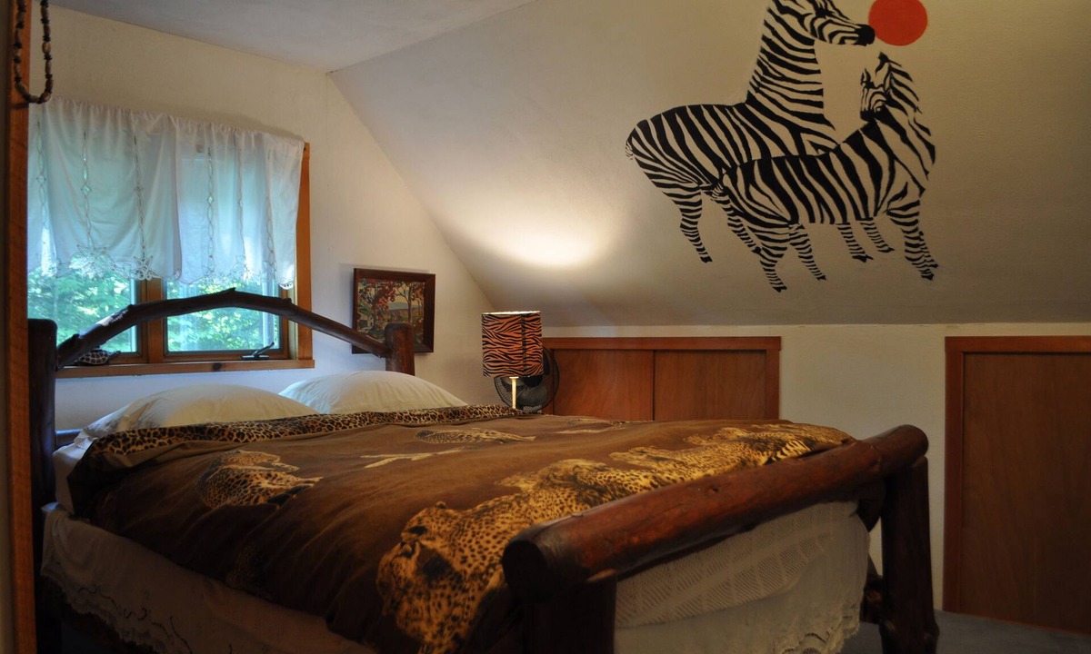 Spencer Bed & Breakfast | Russian and South African room in cabin surrounded by state forest