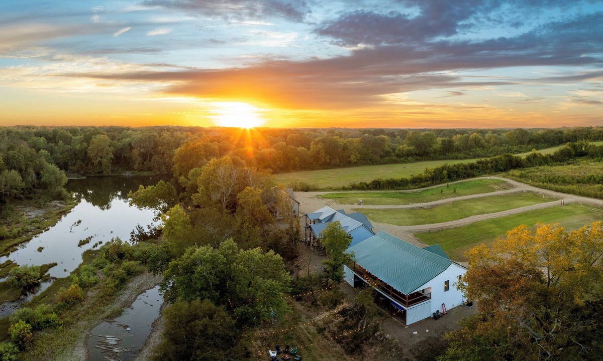 Golden Cabin | Rustic cabin on a quiet stretch of the Glover River. Three queen suites and a bunk loft sleep up to 13. Kayak from the backyard, soak in the hot tub, gather at the fire pit. Inside: game loft with ping pong, and Nintendo. FREE Gym at Sweat Shack.