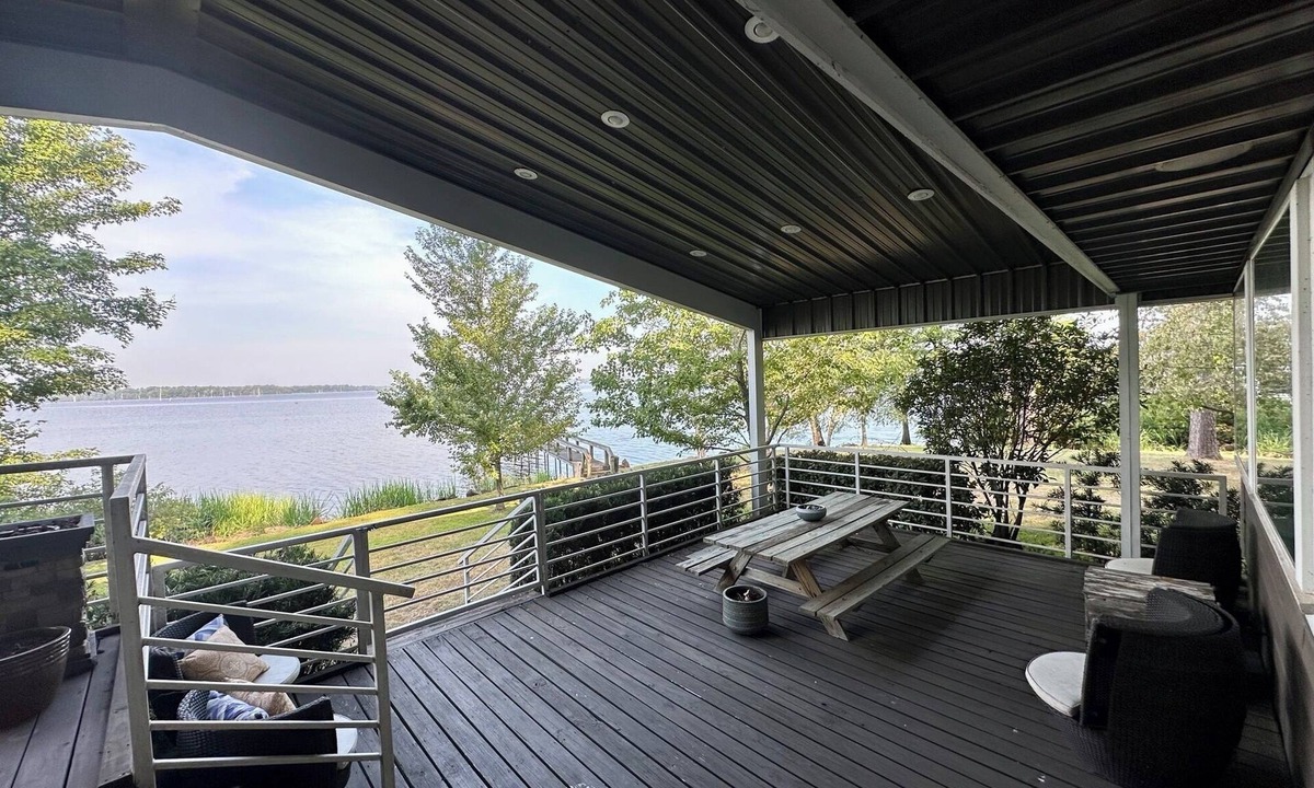 Lafayette County House | Secluded getaway with lakefront views. Spacious covered deck and dock access.