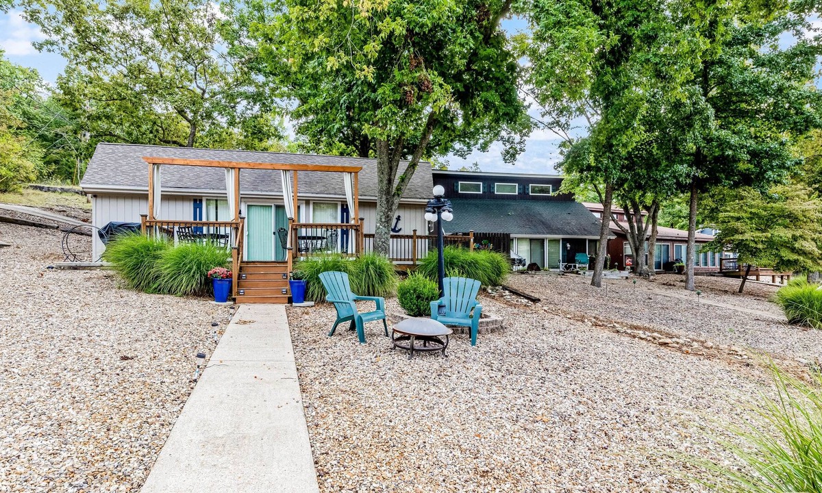 Sunrise Beach Cabin | Secluded lakefront home with private dock, firepit, grill, water views, hammock