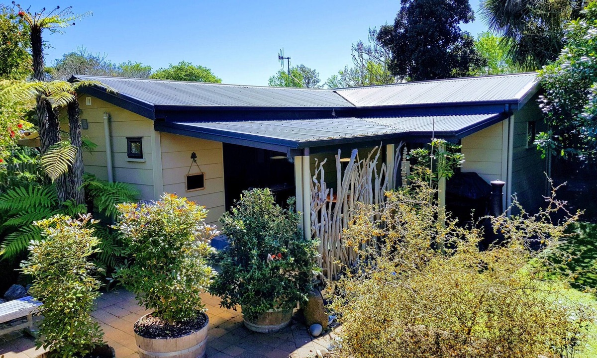 Clive Cottage | Secluded Riverside Cottage set in native garden.