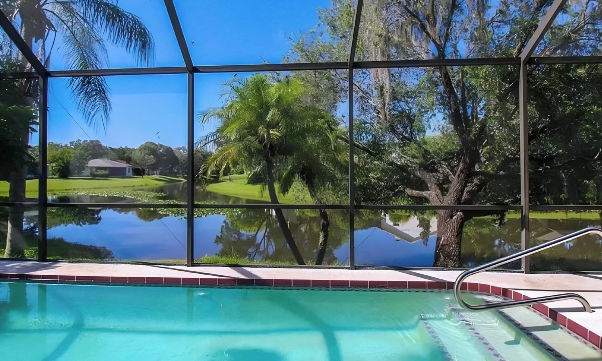Fruitville House | Serene Lakefront Oasis with Stunning Waterfront View & Screened Pool – Sleeps 9