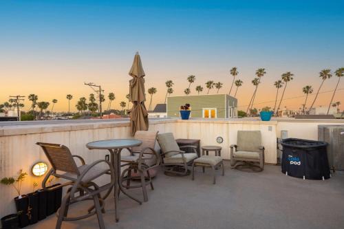 Old Towne House | Seventh Shore Stylish Seal Beach Home w Elevator Fireplace Bold Design