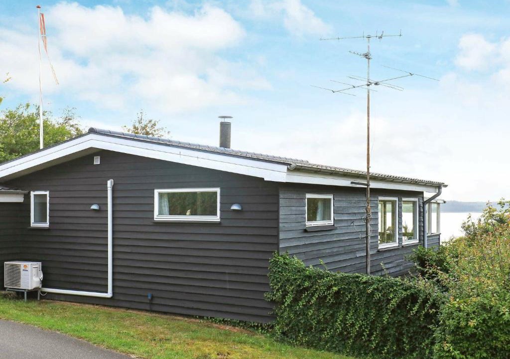 Hjarbæk House | Simplistic Holiday Home in Løgstrup with Terrace