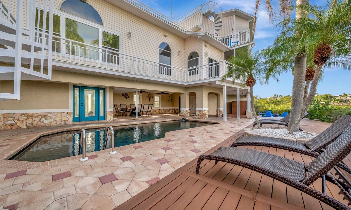 Palm Harbor House | Sleep 16 Waterfront! Hot Tub, Pool & Private Dock!