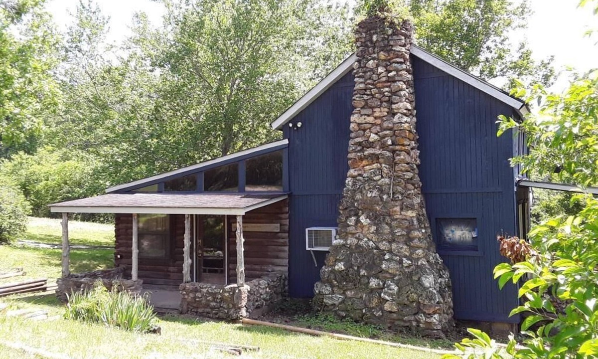 St. James House | Spacious but cozy farmstead lodge has stone fireplace and sleeping for 9 to 10