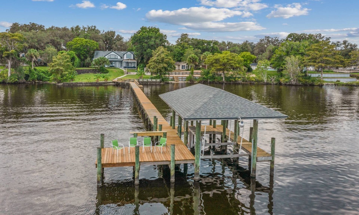 Green Cove Springs House | Spacious riverfront home perfect for larger families, featuring stunning river views, private dock