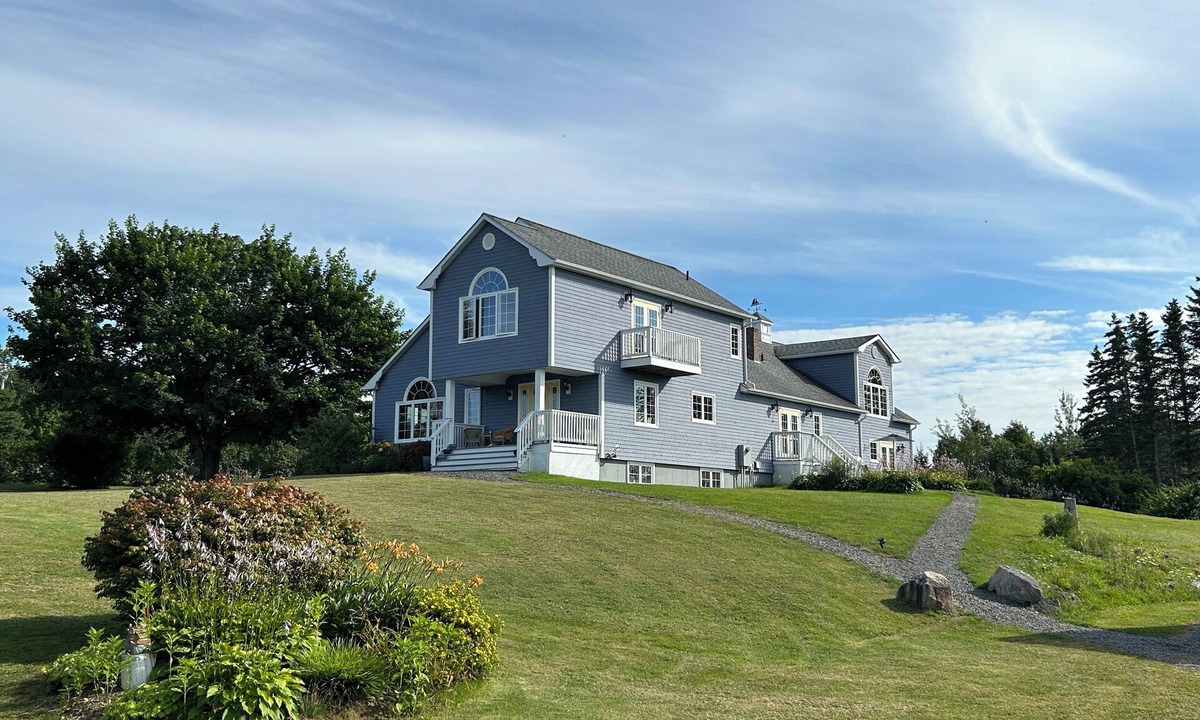 Hall's Harbour Bed & Breakfast | Spacious room with sunset patio, 5 minutes from beach, restaurant and harbour