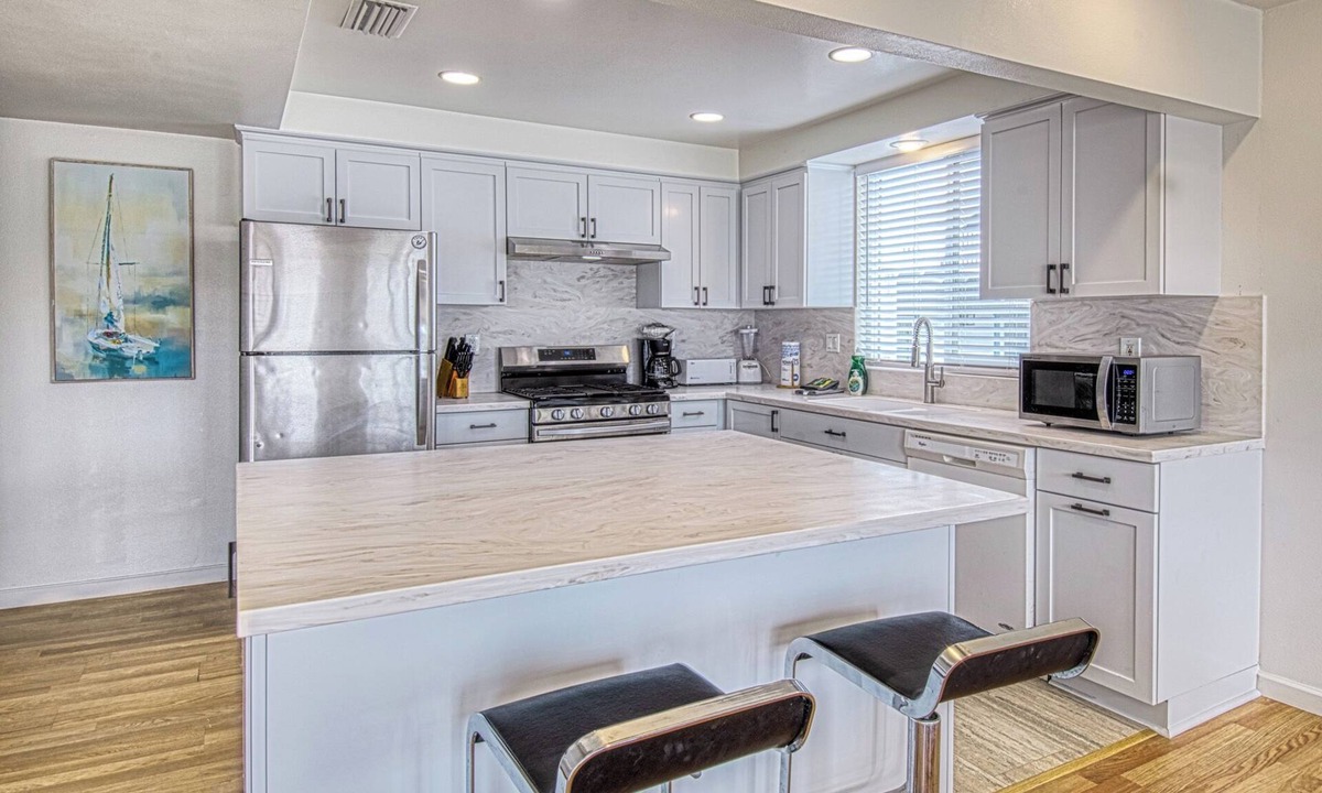 West Newport Apartment | Spacious Upper unit located just two houses from the sand!