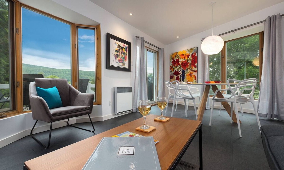 Baie-St-Paul House | Stilt area overlooking a river