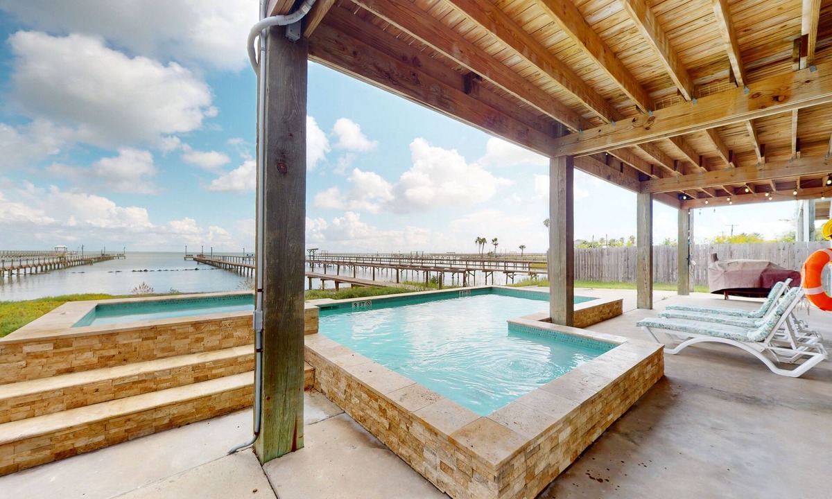 Rockport House | Stunning bay front home with fishing pier, large deck, & private pool