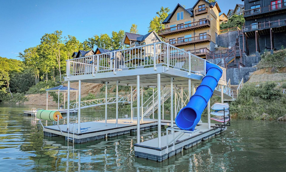 Sevierville Cabin | Stunning Mtn Lodge on Lake with two Story Dock, Indoor Pool, Arcade,and Hot Tub.