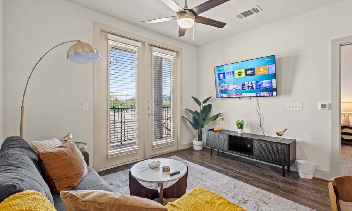 Vickery Meadow Apartment | Sunlit Midtown Suite Pool & Gym Bliss