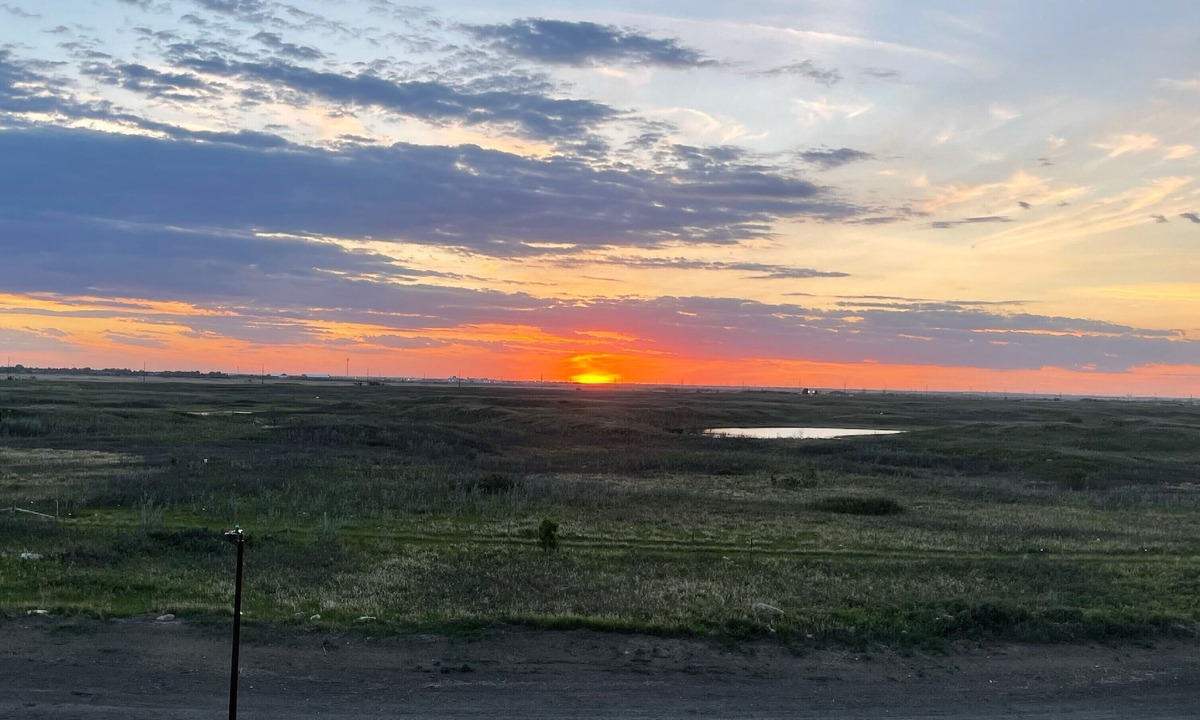 Saskatoon House | Sunset at Prairie Luxury Suite with NE Swale View