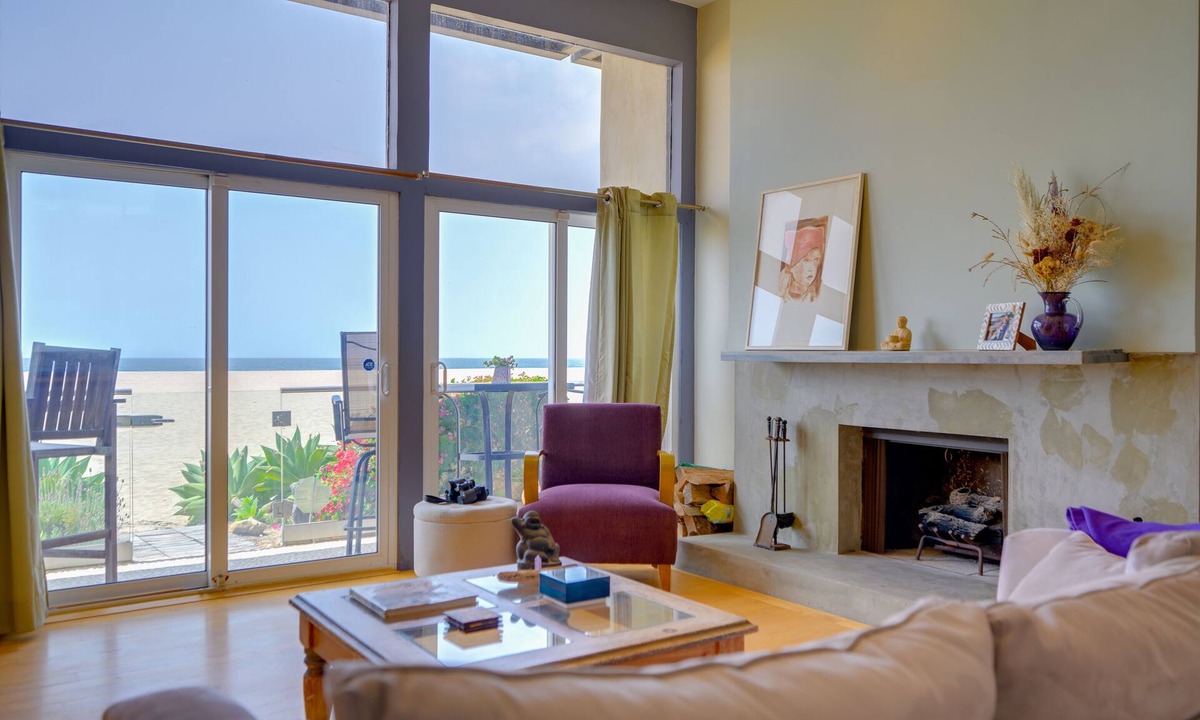 Marina Peninsula Condo | Sunsets and sweeping views, sliding doors open to the sand
