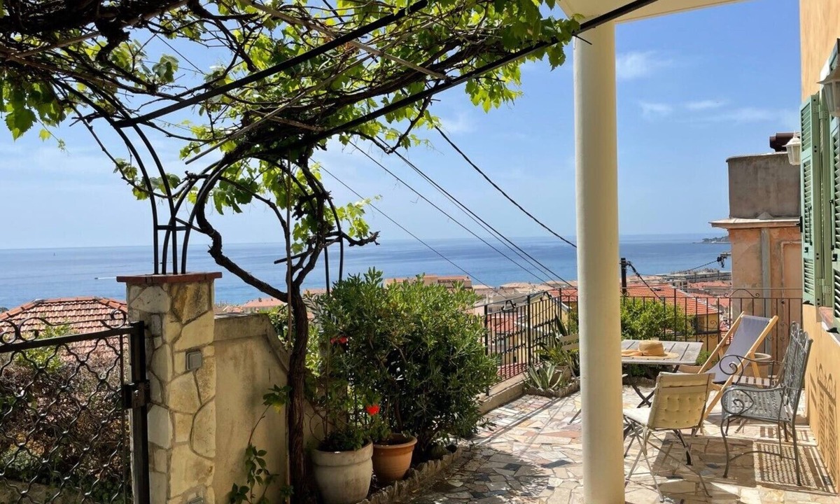 Menton Apartment | Terrace with stunning sea view and pergola with vines