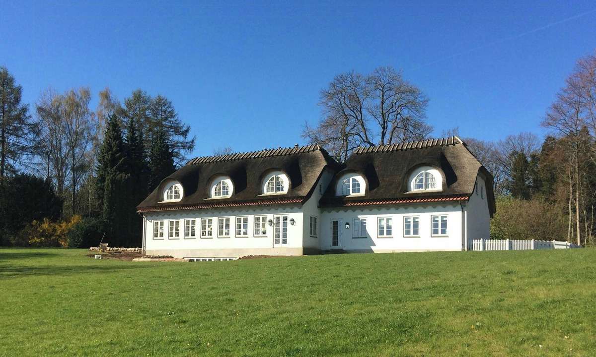 Svendborg House | Thatched landmark in the forest by Valdemar Castle