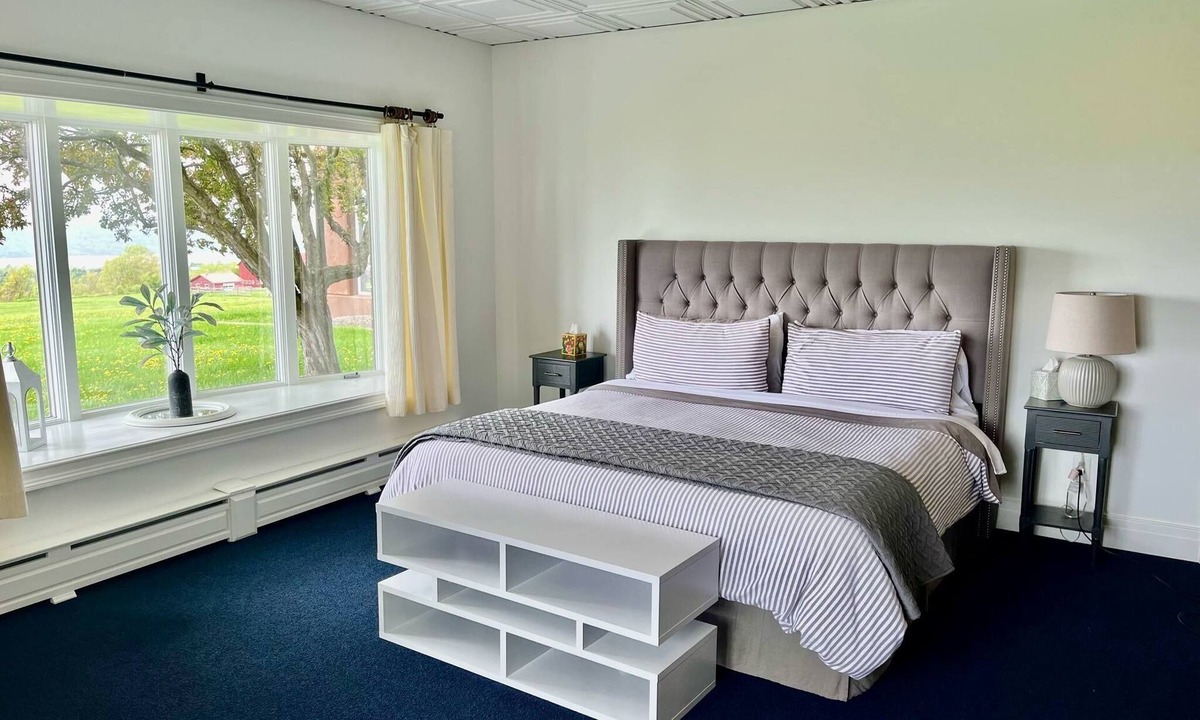 Hector House | The Jade Suite at Diamond on Seneca: King Bed with Lake Views