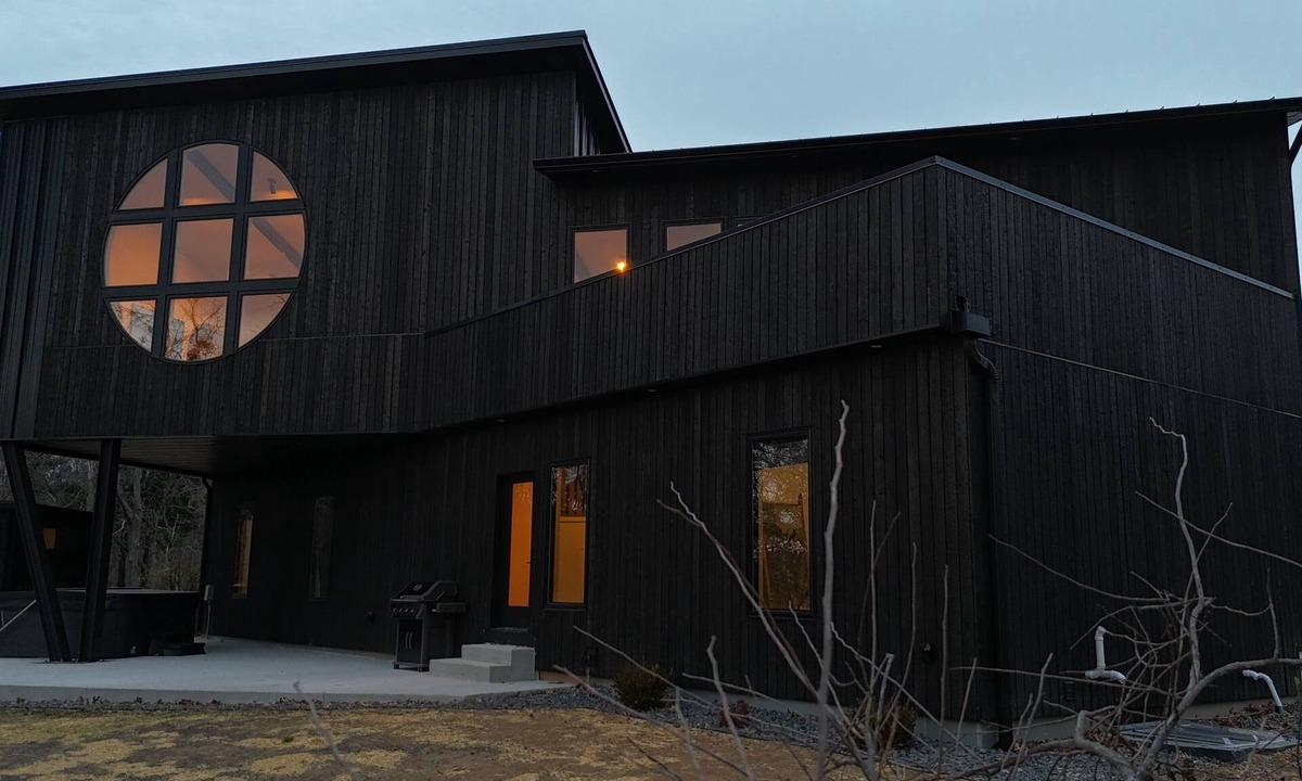 Janesville Cabin | The Overhang · Luxury River Retreat with Sauna, Hot Tub, Movie Theater, & Arcade
