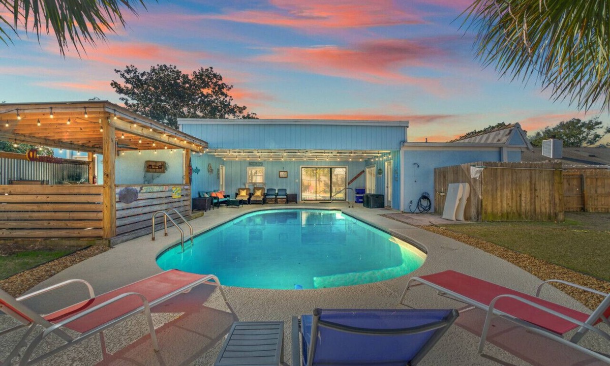 Thomas Drive House | The Tiki Hut ~ Tropical Retreat with Pool, Tiki Bar, Game Room & Dog-Friendly Vibes